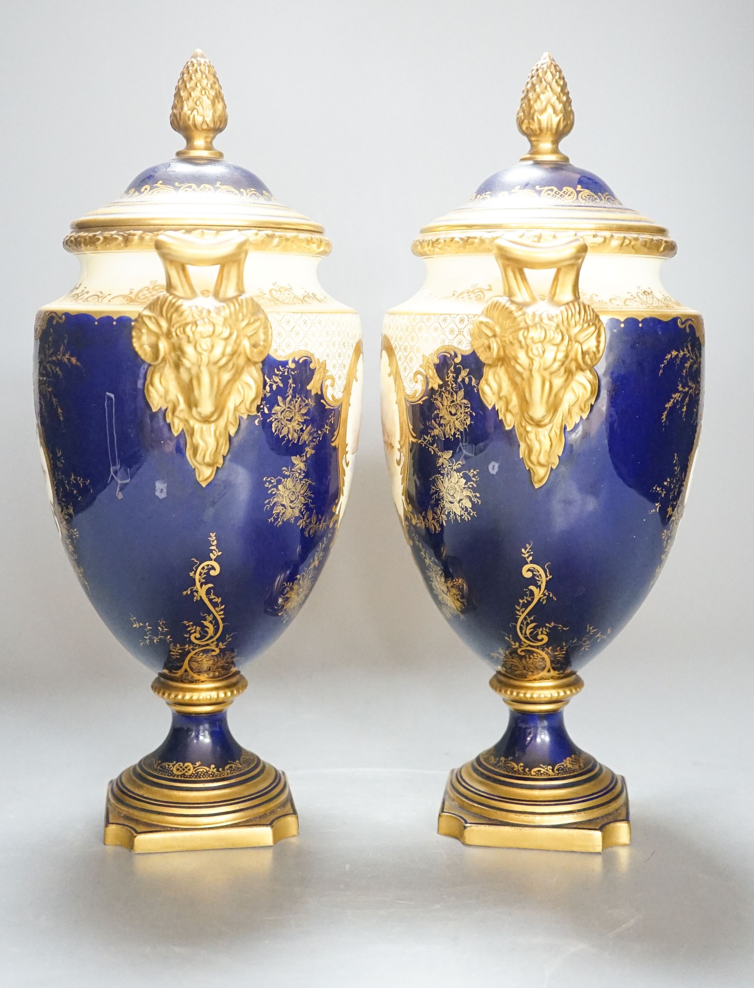 A pair of large Coalport landscape painted vases and covers, c.1900, 30cm